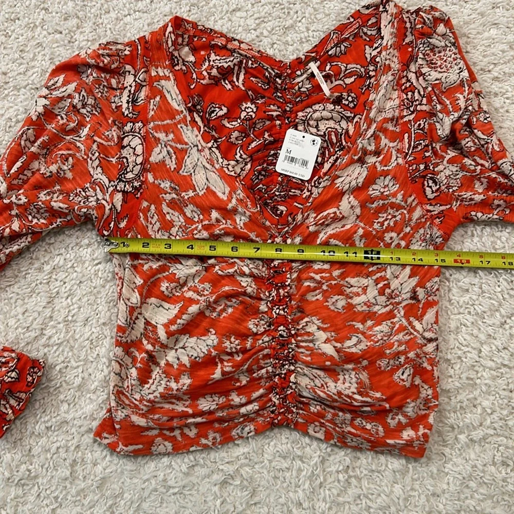 NWT FREE PEOPLE M Say the Word top with balloon sleeves in funky V neck style